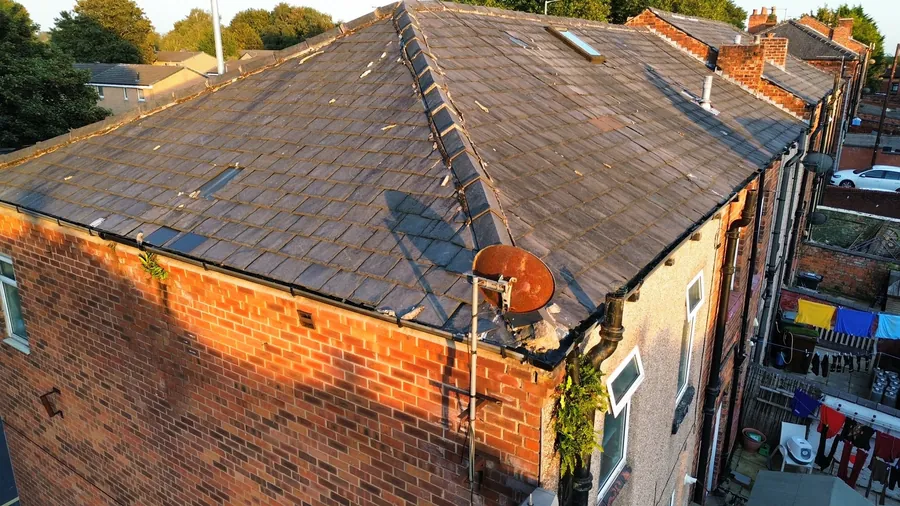 Old worn roof on a corner terrace before work started