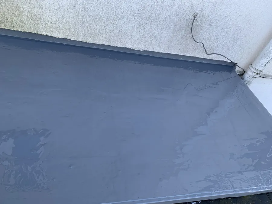 Grey flat roof covering finished and sealed