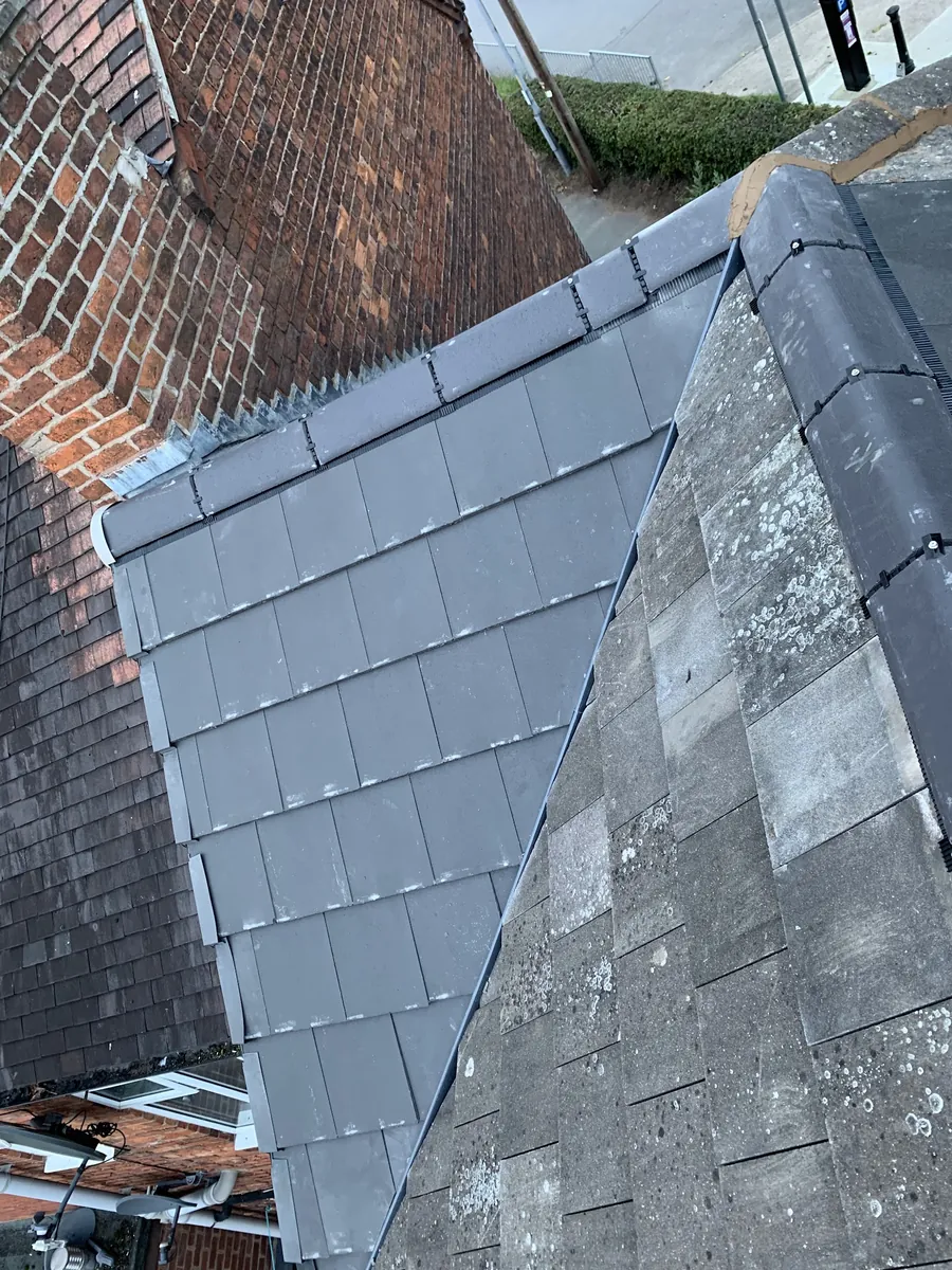 New slates laid where they meet the older roof