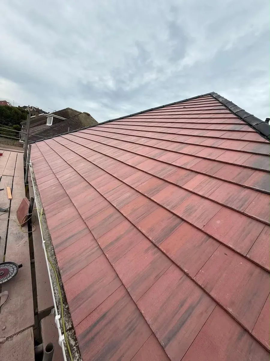 New red-brown tile slope finished to the verge
