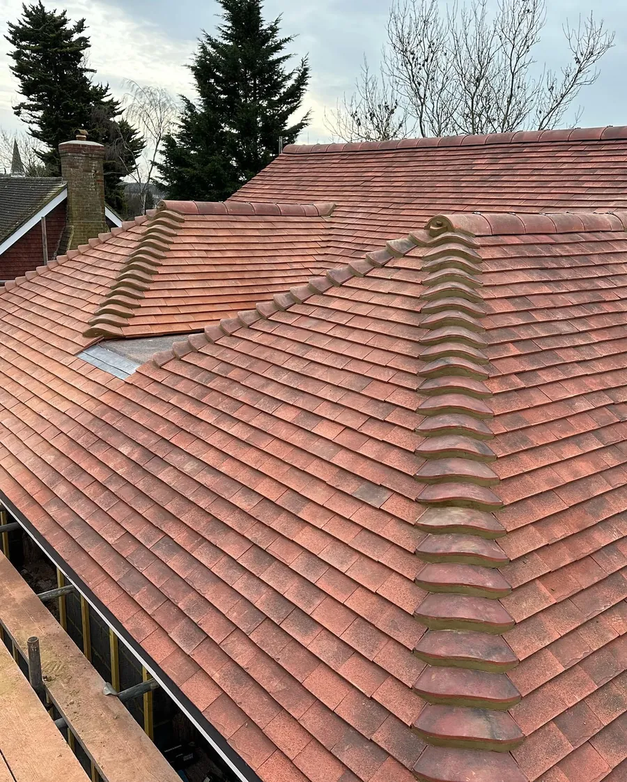 Finished red plain tile hip roof