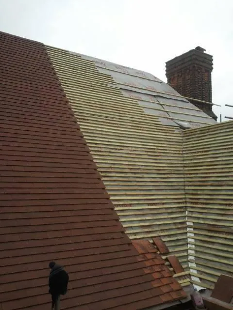 Red tile slope going on up to the chimney