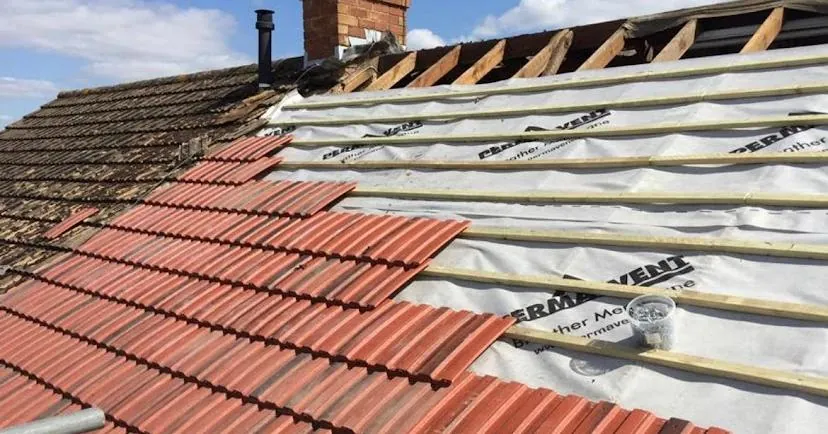 Old red tiles coming off with new membrane going down