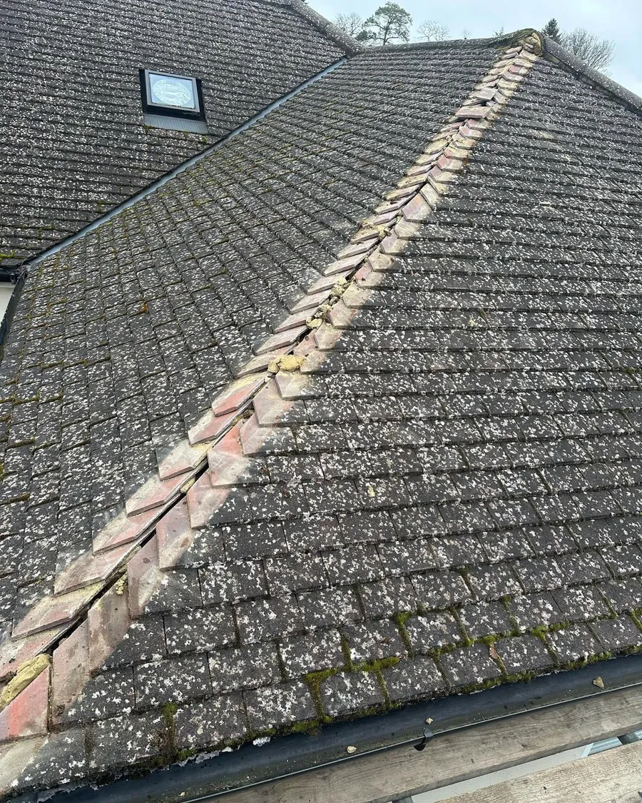 Ridge tiles re-bedded and repointed